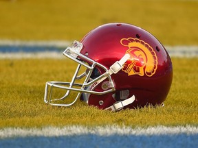 FILE - A Southern California helmet sits in the end zone prior to an NCAA college football game against UCLA, Saturday, Nov. 22, 2014, in Pasadena, Calif. A Los Angeles jury could be the first in the U.S. to decide whether the NCAA failed to protect college football players from repeated blows to the head that cause serious brain injuries. Opening statements are scheduled Thursday, Oct. 20, 2022, in the case of a former University of Southern California linebacker who had significant brain damage when he died at age 49.