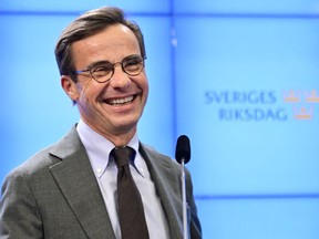 The Moderate party leader Ulf Kristersson speaks at a press conference on the formation of the new Swedish government, in Stockholm, Wednesday, Oct. 12, 2022.