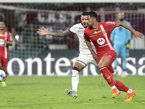 Torino's Antonio Sanabria and Monza's Pablo Mari, right, in action during the Italian Serie A soccer match between Monza and Torino at the U-Power Stadium in Monza, Italy, on Aug. 13, 2022. Pablo Marí, the Spanish soccer player who was wounded in a knife attack at an Italian shopping center, called himself "lucky" to survive and was being treated Friday following injuries to his back and mouth.