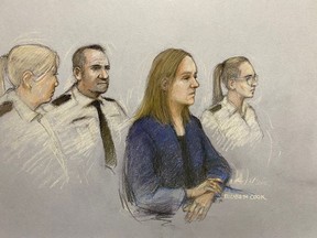 This court artist sketch by Elizabeth Cook shows Lucy Letby appearing in the dock at Manchester Crown Court, in Manchester, England, Monday Oct. 10, 2022. Letby, 32, has been charged with murder in the deaths of five baby boys and two girls, and the attempted murder of five boys and five girls, while she worked at the Countess of Chester Hospital in northwest England between 2015 and 2016.