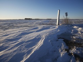 A border marker is shown just outside of Emerson, Man., Thursday, Jan. 20, 2022. Mounties have confirmed some of the movements of an Indian migrant family who froze to death near the Canadian-U.S. border earlier this year, but say they are still unsure how the family made it there.