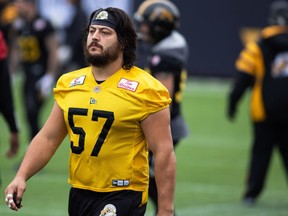 Hamilton Tiger-Cats offensive lineman Brandon Revenberg (57) takes part in a practice at Tim Hortons Field during the CFL's Grey Cup week in Hamilton, Ontario on Friday, December 10, 2021.