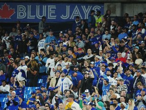 Fans watch as the Seattle Mariners take on the Toronto Blue Jays during ninth inning American League wild card MLB postseason baseball action in Toronto on Friday, October 7, 2022.