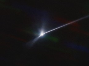 This image made available by NOIRLab shows a plume of dust and debris blasted from the surface of the asteroid Dimorphos by NASA's DART spacecraft after it impacted on Sept. 26, 2022, captured by the U.S. National Science Foundation's NOIRLab's SOAR telescope in Chile. The expanding, comet-like tail is more than 6,000 miles (10,000 kilometers) long. (Teddy Kareta, Matthew Knight/NOIRLab via AP)