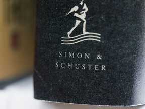 FILE - A book published by Simon & Schuster is displayed on Saturday, July 30, 2022, in Tigard, Ore. On Monday, Oct. 31, 2022, a federal judge blocked Penguin Random House's proposed purchase of Simon & Schuster.