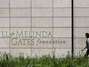 FILE - A person walks by the headquarters of the Bill and Melinda Gates Foundation on April 27, 2018, in Seattle. The Bill and Melinda Gates Foundation announced Sunday, Oct. 16, 2022, that it will commit $1.2 billion to the effort to end polio worldwide.