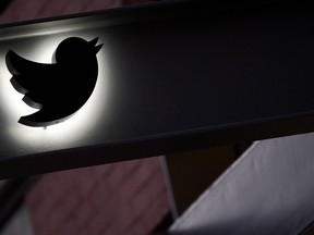 The Twitter logo is seen on the awning of the building that houses the Twitter office in New York, Wednesday, Oct. 26, 2022. Elon Musk posted a video Wednesday showing him strolling into Twitter headquarters ahead of a Friday deadline to close his $44 billion deal to buy the company.