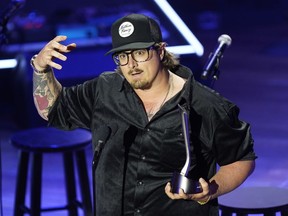 FILE - Hardy accepts the Songwriter of the Year award during the Academy of Country Music Honors awards on Aug. 24, 2022, in Nashville, Tenn. A tour bus carrying country music singer and songwriter Hardy and three others was involved in a crash that injured everyone on board.