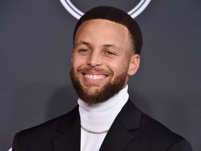 FILE - NBA basketball player Stephen Curry, of the Golden State Warriors, arrives at the ESPY Awards in Los Angeles on July 20, 2022. Curry is launching a graphic novel series, "Stephen Curry Presents!: Sports Superheroes," in partnership with Penguin Workshop. The first of four planned installments will focus on Curry's career and is scheduled for fall 2024.