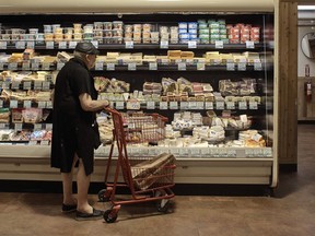 FILE - A man shops at a supermarket on Wednesday, July 27, 2022, in New York. On Thursday, Oct. 13, 2022, the U.S. government is set to announce what's virtually certain to be the largest increase in Social Security benefits in 40 years. The boost is meant to allow beneficiaries to keep up with inflation, and plenty of controversy surrounds the move.