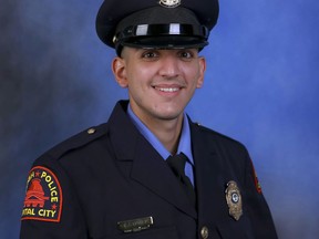 This photo provided by the Raleigh Police Department shows Officer Gabriel Torres, one of the victims of a shooting attack that stretched from the streets of a Raleigh neighborhood to a nearby walking trail last Thursday. (The Raleigh Police Department via AP)