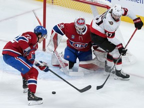 Montreal Canadiens goalie Sam Montembeault and teammate Arber Xhekaj (72) clear the puck away from Ottawa Senators' Mark Kastelic (47) during first period NHL hockey action in Montreal, Tuesday, Oct. 4, 2022. The Senators and Kastelic have agreed on a two-year contract extension, the team announced Thursday.