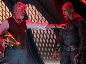 "Hey buddy, back away from the Helmet of Fate!" Pierce Brosnan and Dwayne Johnson in Black Adam.