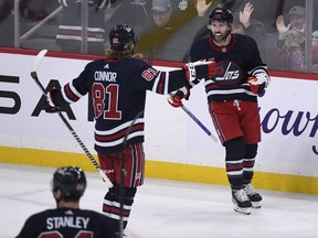 Winnipeg Jets' Sam Gagner (right) celebrates his goal against the St. Louis Blues with teammate Kyle Connor during the third period of NHL action in Winnipeg on Monday, October 24, 2022. NHL players choosing their own goal songs is trending in a sport that's historically emphasized team and downplayed the individual.