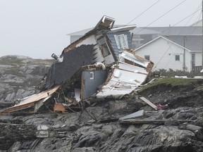 Remains of a home destroyed during hurricane Fiona are seen in Port aux Basques, N.L., Monday, Sept. 26, 2022.
