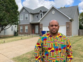 Abdul-Kaba Abdullah stands in front of his former home in St. Louis on Friday, Oct. 7, 2022. Abdullah sold the home two years ago for less than he thought it was worth after an appraisal came in lower than expected. He believes the appraisal was low because the home is in north St. Louis, a predominantly Black area of the city. St. Louis is among several U.S. cities where realtors have recently apologized for past housing discrimination and announced new efforts to protect housing rights.
