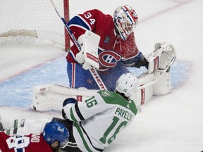 Montreal Canadiens goaltender Jake Allen (34) stops Dallas Stars' Joe Pavelski (16) during second period NHL hockey action Saturday, Oct. 22, 2022 in Montreal.