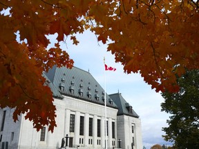 The Supreme Court of Canada is pictured under fall coloured leaves in Ottawa, on Thursday, Oct. 20, 2022.&ampnbsp;The Supreme Court of Canada will look at whether a law banning publication of certain proceedings in criminal matters applies before the selection of a jury.
