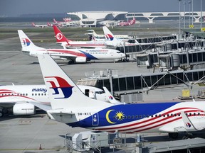 FILE - Malaysia Airlines planes taxi at a terminal while taking passengers at Kuala Lumpur International Airport in Sepang, Malaysia, on April 1, 2022. The U.S. Federal Aviation Administration has upgraded Malaysia's air safety rating to Category 1, allowing the country's carriers to expand flights to the United States after a three-year hiatus, Transport Minister Wee Ka Siong said Saturday, Oct. 1.