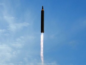 FILE - This undated photo distributed on  Sept. 16, 2017, by the North Korean government shows what was said to be the test launch of an intermediate range Hwasong-12 in North Korea. North Korea on Tuesday, Oct. 4, 2022 fired an intermediate-range ballistic missile over Japan for the first time in five years. Japanese Defense Minister Yasukazu Hamada said one launched Tuesday could be the same as the Hwasong-12 missile that North has fired four times in the past. The content of this image is as provided and cannot be independently verified. (Korean Central News Agency/Korea News Service via AP, File)