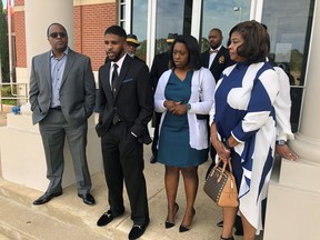 Brandon Calloway, second from left, speaks with a reporter alongside his family about his violent arrest in July for alleged traffic violations on Monday, Oct. 24, 2022, in Somerville, Tenn. Also pictured are Calloway's father, Ed Calloway, left, sister Raven Calloway, second from right, and mother, Dinishia Calloway, right.