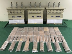 The photo provided by Hong Kong Government Information Services shows the suspected methamphetamine seized at Hong Kong International Airport and the electric transformers used to conceal the drugs in Hong Kong on Oct. 18, 2022. The Hong Kong customs department said Tuesday, Oct. 18, it had seized methamphetamine that could be worth about $5.9 million in the market after its officers uncovered the drug hidden in electric transformers. (Hong Kong Government Information Services via AP)