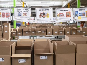 Boxes wait to be filled with provisions at The Daily Bread Food Bank warehouse in Toronto on Wednesday, March 18, 2020.
