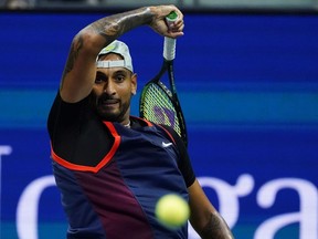 Nick Kyrgios, of Australia, returns to Karen Khachanov, of Russia, during the quarterfinals of the U.S. Open tennis championships, Tuesday, Sept. 6, 2022, in New York.