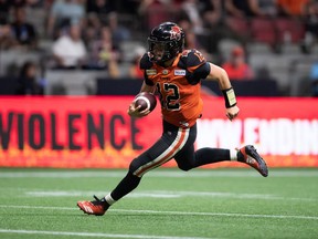 B.C. Lions quarterback Nathan Rourke runs for a touchdown during the second half of CFL football game against the Edmonton Elks in Vancouver, on Saturday, August 6, 2022.