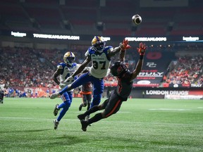 B.C. Lions' Keon Hatcher (4) fails to make the reception in the end zone as Winnipeg Blue Bombers' Brandon Alexander (37) defends during the first half of CFL football game in Vancouver, on Saturday, October 15, 2022.