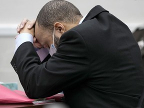 Darrell Brooks reacts as the guilty verdict is read during his trial in a Waukesha County Circuit Court in Waukesha, Wis., on Wednesday, Oct. 26, 2022. Brooks, who is represented himself during the trial, was charged with driving into a Waukesha Christmas Parade last year, killing six people and injuring dozens more.
