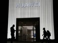 Two suspected Chinese intelligence officers have been charged with attempting to obstruct a criminal investigation and prosecution of Chinese tech giant Huawei, according to court documents unsealed Monday, Oct. 24, 2022.