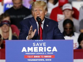 FILE - Former President Donald Trump speaks at a campaign rally in Youngstown, Ohio., Sept. 17, 2022. Trump is finally opening his checkbook and reserving millions of dollars in airtime for ads to bolster his endorsed candidates in key midterm races just one month before Election Day. Trump's newly-formed MAGA Inc. Super PAC has so far placed reservations in Pennsylvania, Ohio and Arizona, according to the ad tracking firm AdImpact.