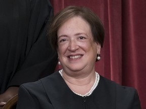 FILE - Associate Justice Elena Kagan joins other members of the Supreme Court as they pose for a new group portrait, at the Supreme Court building in Washington, Oct. 7, 2022. Kagan said Friday, Oct. 21, that "time will tell" whether the Supreme Court can get back to "finding common ground" after a term in which the court's six conservatives and three liberals split over major issues including abortion and gun rights.