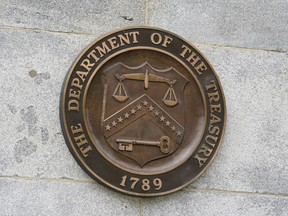 The Department of the Treasury's seal outside the Treasury Department building in Washington on May 4, 2021. The Treasury Department said Monday that it has sanctioned a group of high-ranking members of the Somalia-based al-Shabab militant group, who act as key middle men between the group and local companies in Somalia. Treasury's Office of Foreign Assets Control imposed the sanctions on more than a dozen individuals from Somalia and Yemen who are involved in al-Shabab's financing operations which in turn use those funds to assist in weapons procurement and recruitment activities.