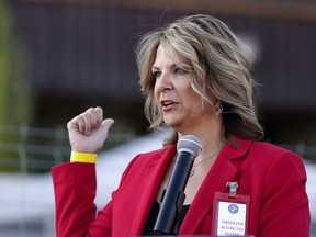 FILE - Kelli Ward, chair of the Arizona Republican Party, holds a news conference in Phoenix, Nov. 18, 2020. Ward refused to answer questions during a deposition of the House committee investigating the Jan. 6 insurrection at the Capitol, an attorney for the panel revealed Tuesday, Oct. 4, 2022, during a court hearing in Phoenix.