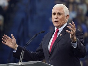 FILE - Former Vice President Mike Pence gestures as he addresses the Convocation at Liberty University, Sep. 14, 2022, in Lynchburg, Va. By refusing to go along with former president Donald Trump's unconstitutional push to overturn the results of the 2020 election, Pence became a leading target of Trump's wrath and a pariah in many Republican circles. But in the final weeks of an intensely competitive midterm election, Pence's fortunes may be shifting. He's an in-demand surrogate for Republican campaigns, including from some candidates who have spent much of the year hugging Trump and parroting his lie that the election was stolen.