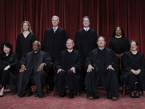 FILE - Members of the Supreme Court sit for a new group portrait following the addition of Associate Justice Ketanji Brown Jackson, at the Supreme Court building in Washington, Oct. 7, 2022. Bottom row, from left, Associate Justice Sonia Sotomayor, Associate Justice Clarence Thomas, Chief Justice of the United States John Roberts, Associate Justice Samuel Alito, and Associate Justice Elena Kagan. Top row, from left, Associate Justice Amy Coney Barrett, Associate Justice Neil Gorsuch, Associate Justice Brett Kavanaugh, and Associate Justice Ketanji Brown Jackson.