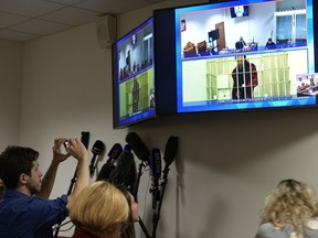 WNBA star and two-time Olympic gold medalist Brittney Griner is seen on the bottom part of a TV screen as she appears in a video link provided by the Russian Federal Penitentiary Service a courtroom prior to a hearing at the Moscow Regional Court in Moscow, Russia, Tuesday, Oct. 25, 2022. A Russian court has started hearing American basketball star Brittney Griner's appeal against her nine-year prison sentence for drug possession