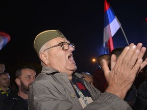 A man wearing a traditional Serbian hat shout slogans during a protest against alleged election fraud in the general elections in the Bosnian town of Banja Luka, 240 kms northwest of Sarajevo, Sunday, Oct. 9, 2022. Thousands on Sunday rallied in Bosnia for the second time in a week, alleging that pro-Russian Bosnian Serb leader Milorad Dodik rigged a ballot during a general election in the Balkan country last weekend.