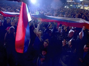 People protest against alleged election fraud in a general elections in the Bosnian town of Banja Luka, 240 kms northwest of Sarajevo, Sunday, Oct. 9, 2022. Thousands on Sunday rallied in Bosnia for the second time in a week, alleging that pro-Russian Bosnian Serb leader Milorad Dodik rigged a ballot during a general election in the Balkan country last weekend.