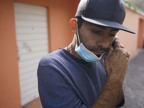 Jose Cuicas from Venezuela listens to an audio message on his phone outside of a migrant shelter in Mexico City, Thursday, Oct. 20, 2022. The mechanic is one of some 1,700 Venezuelans that U.S. authorities expelled to Mexico in the past week under a deal between the U.S. and Mexico to deny them the right to U.S. asylum and try to keep them from coming to the border.