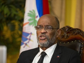 FILE - Haiti's Prime Minister Ariel Henry speaks during an interview with the Associated Press at his private residence in Port-au-Prince, Tuesday, Sept. 28, 2021. Henry and 18 top-ranking officials have requested on the second week of Oct. 2022, the immediate deployment of foreign armed troops as gangs and protesters paralyze the country.