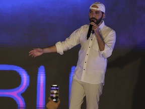 FILE - El Salvador's President Nayib Bukele participates in the closing ceremony of a congress for cryptocurrency investors in Santa Maria Mizata, El Salvador, Saturday, Nov. 20, 2021. Bukele has announced on the country's Independence Day that he will seek re-election to a second five-year term, one year after the new justices of the Constitutional Chamber of the Supreme Court appointed by his allies in the Legislative Assembly overturned the country's constitutional ban on consecutive re-election.