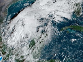 This satellite image taken at 9:30am ET and provided by NOAA shows Tropical Storm Karl in the Gulf of Mexico, on Wednesday, Oct. 12, 2022. Karl grew a little stronger off Mexico's southern Gulf coast on Wednesday and was expected to approach land by the weekend without gaining hurricane strength. (NOAA via AP)