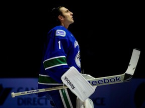 Vancouver Canucks goalie Roberto Luongo looks on during the singing of "O Canada" before playing the Edmonton Oilers during an NHL hockey game in Vancouver, B.C., on Sunday January 20, 2013.&ampnbsp;Former Vancouver Canucks goaltender Roberto Luongo is to be inducted into the team's Ring of Honour next season.THE CANADIAN PRESS/Darryl Dyck