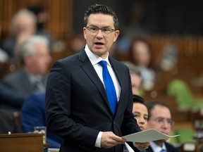 Conservative Leader Pierre Poilievre rises during Question Period, in Ottawa, Friday, Oct. 21, 2022. THE CANADIAN PRESS/Adrian Wyld