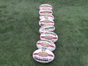 Rugby balls sit on a field in Toronto on Thursday, May 4, 2017. Henry Paul has stepped down as head coach of Canada's men's rugby sevens team after three years leading the squad.