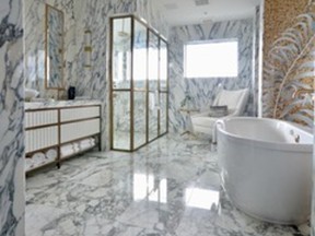 Luxurious Arabescato Corchia marble is bold and beautiful in this principal ensuite designed by Meredith Heron.