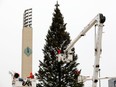 IN 2021, crews decorate Edmonton's giant Christmas treein ChurchillSquare.The annual holiday light up festival will be moved this year.
